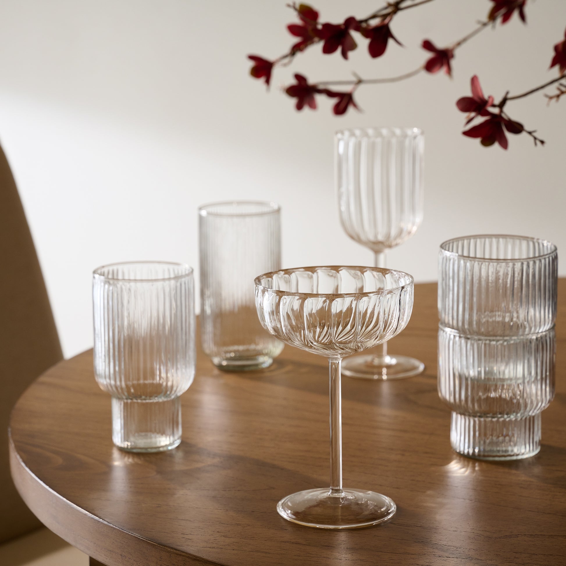 Fluted Coupe Glass with other various drinking glasses