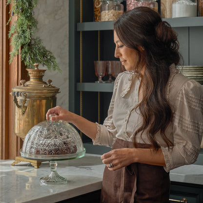 Joanna Gaines stands next to the Vivian Cut Glass Cake Stand in a kitchen