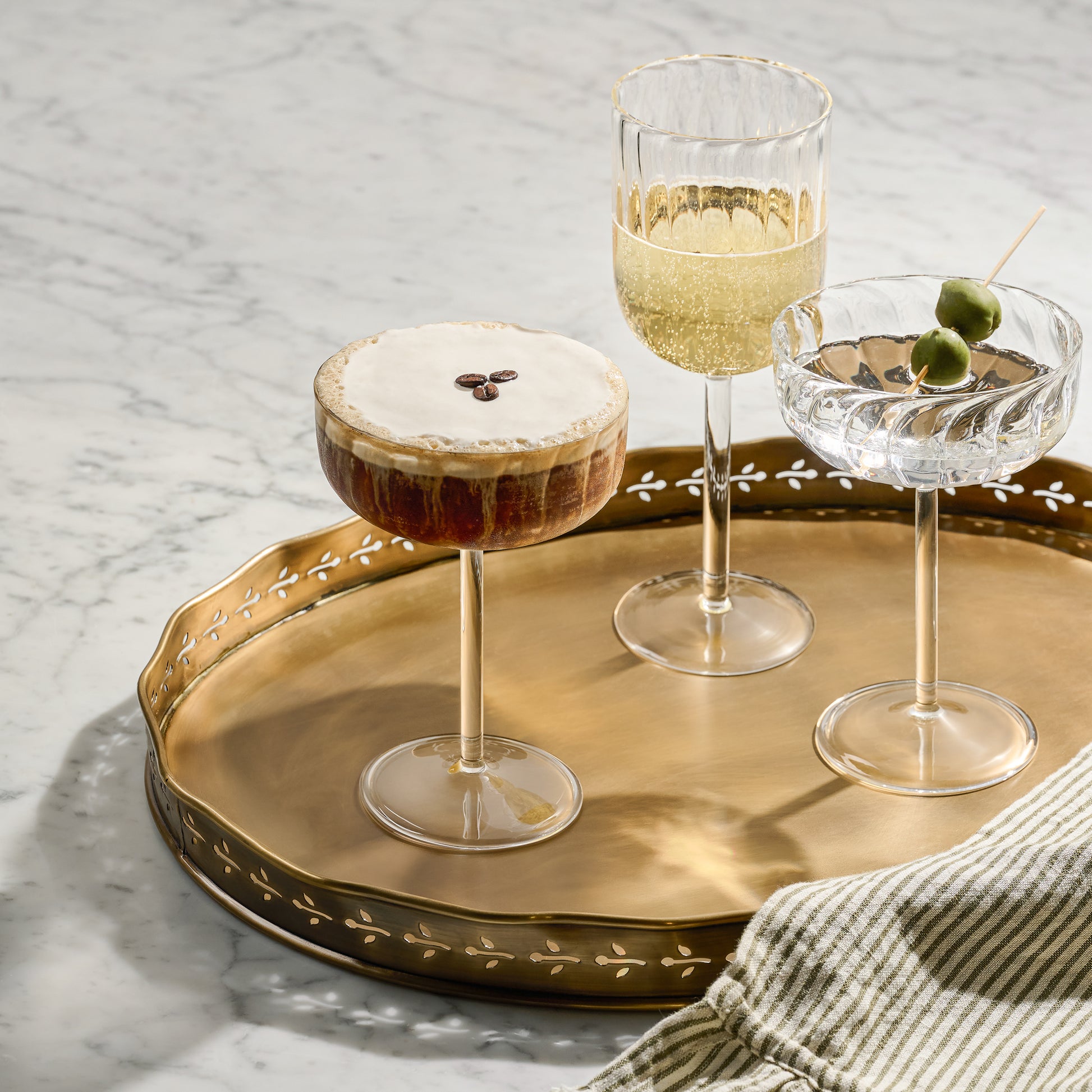 Fluted Wine Glass with wine with other drinks on platter