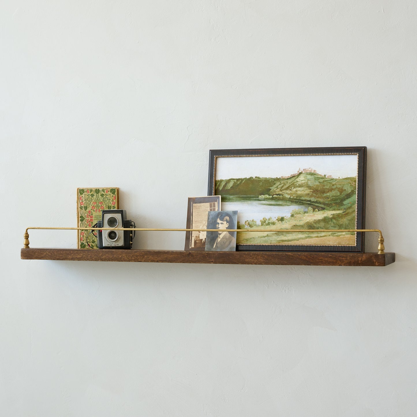 Elliott Wood and Brass Picture Ledge in large size with art and decor on top