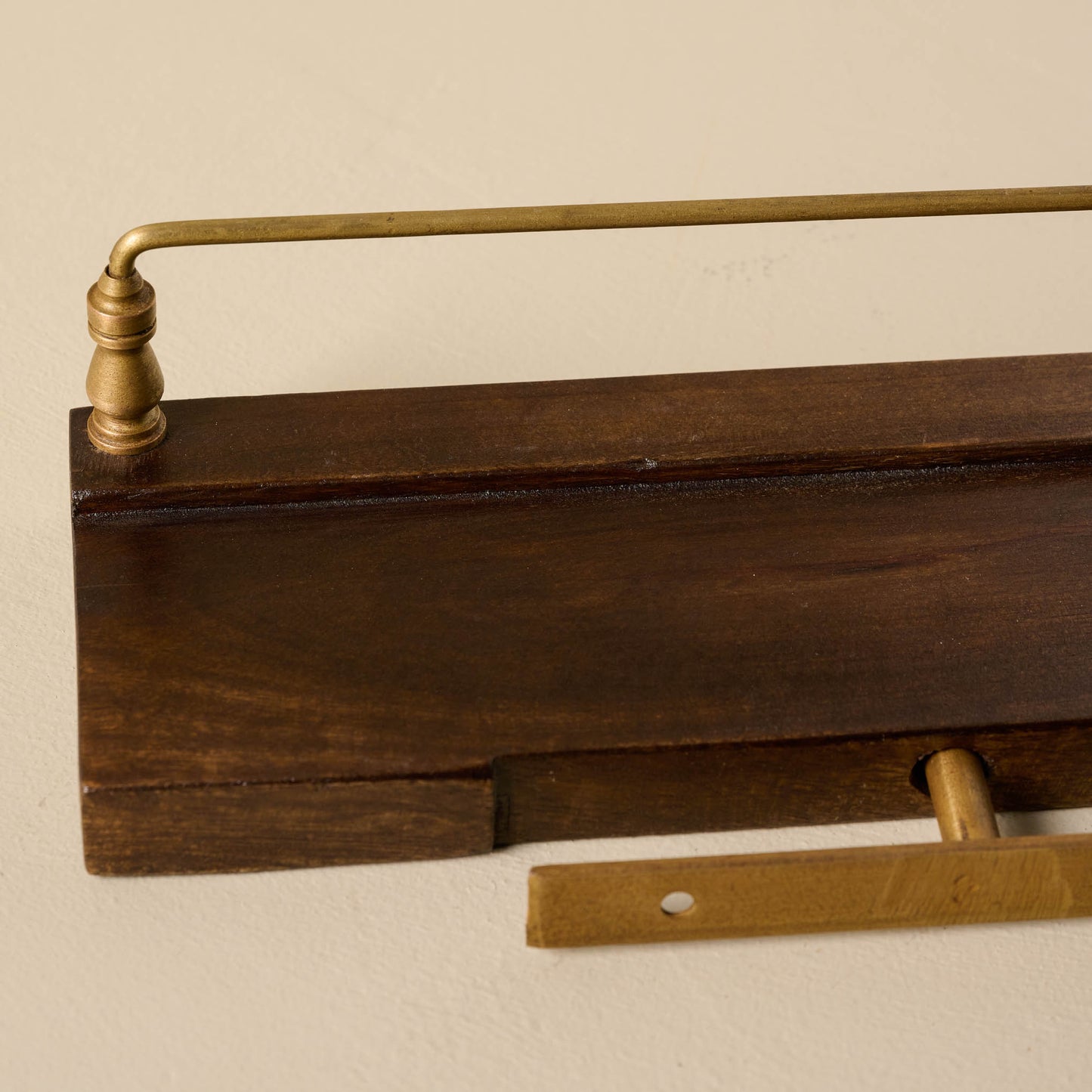 Elliott Wood and Brass Picture Ledge close up of wall hanging hardware