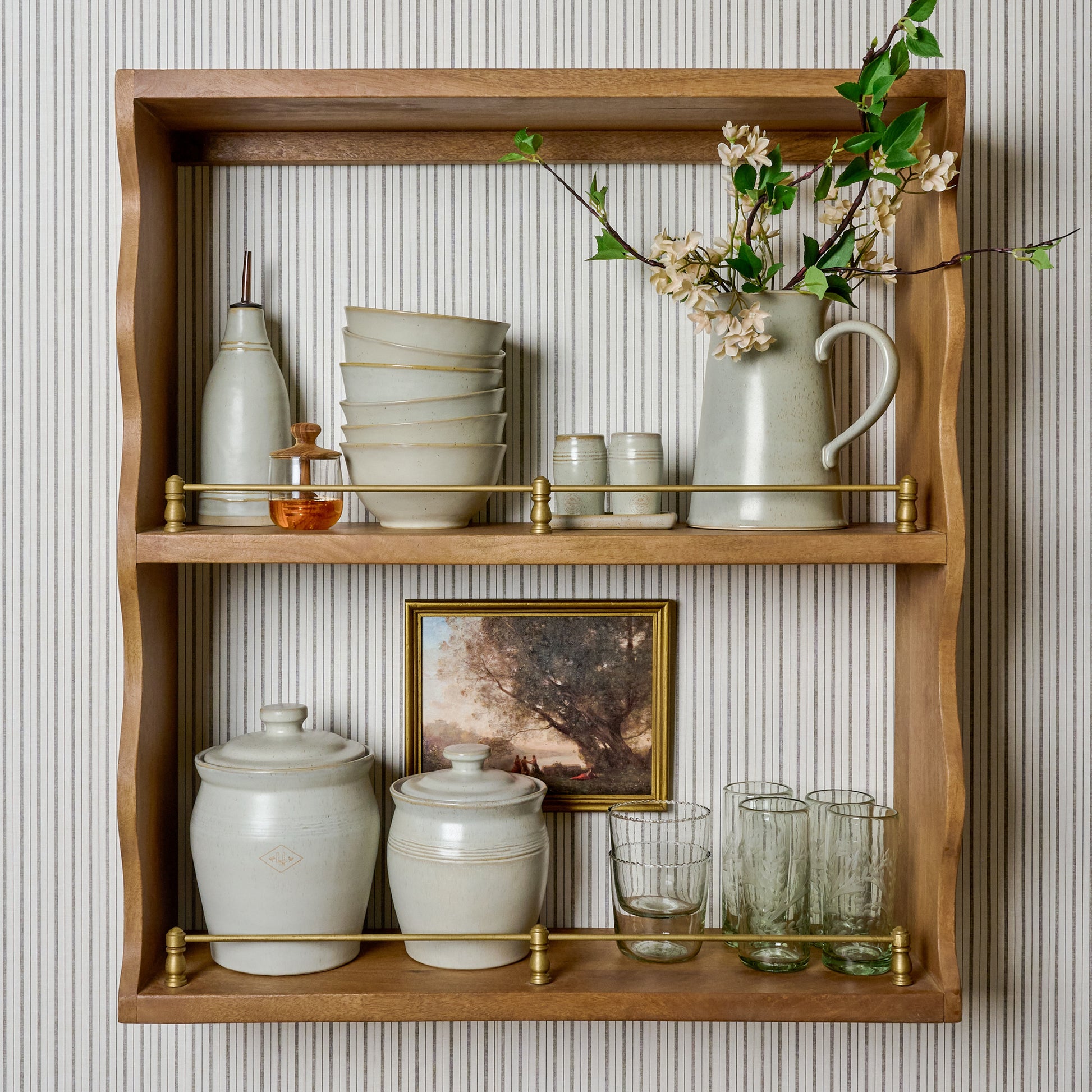 Faye Scallop Shelf with Brass Rails with glassware and canisters on shelves