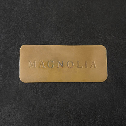 Gilded Wreath Mirrored Wall Sconce close up of magnolia logo on back 