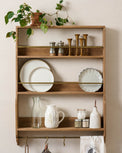 Hannon Wood and Brass Display Shelf with spring kitchen items on shelves