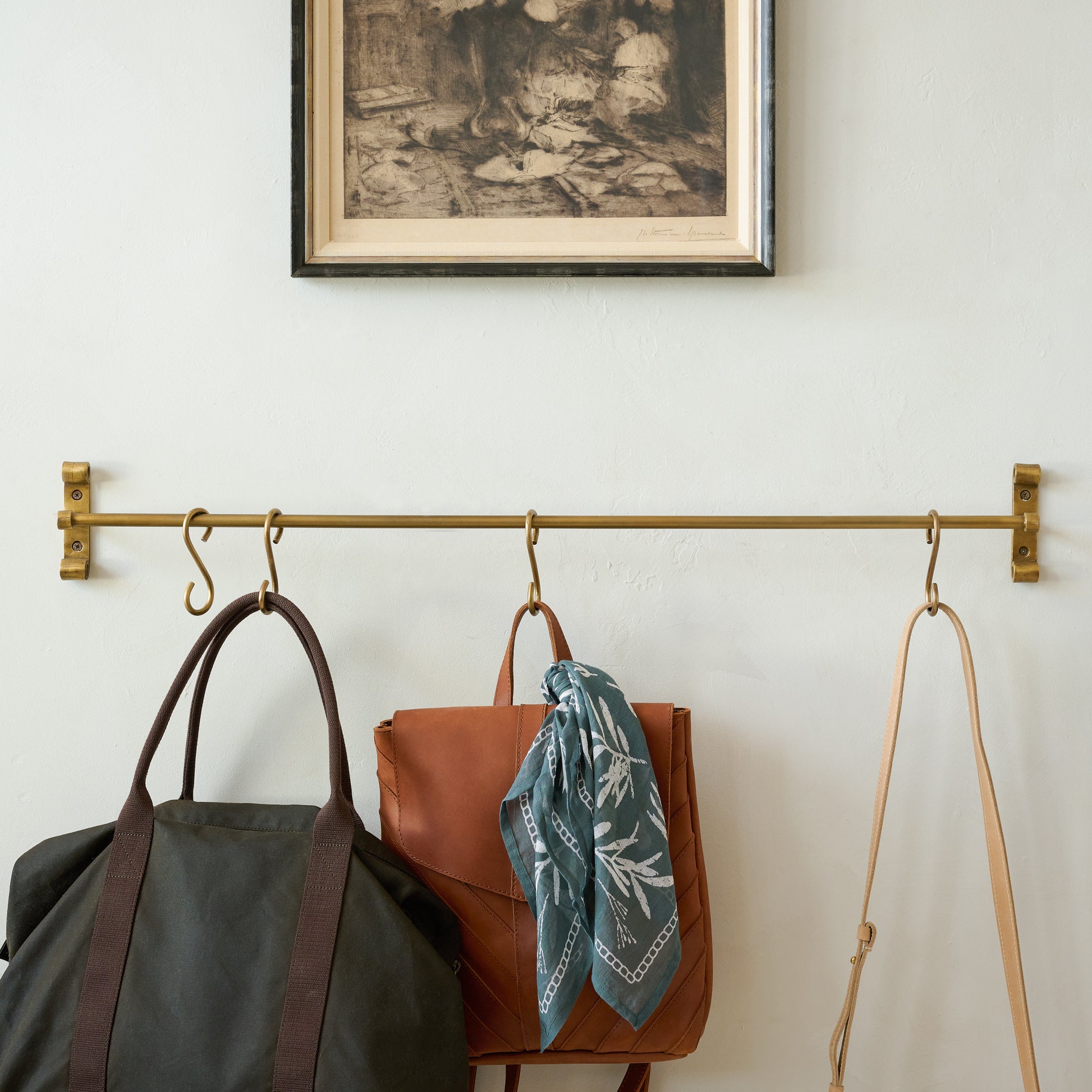 Duke Brass Rail with Hooks with purses and backpacks hung on hooks
