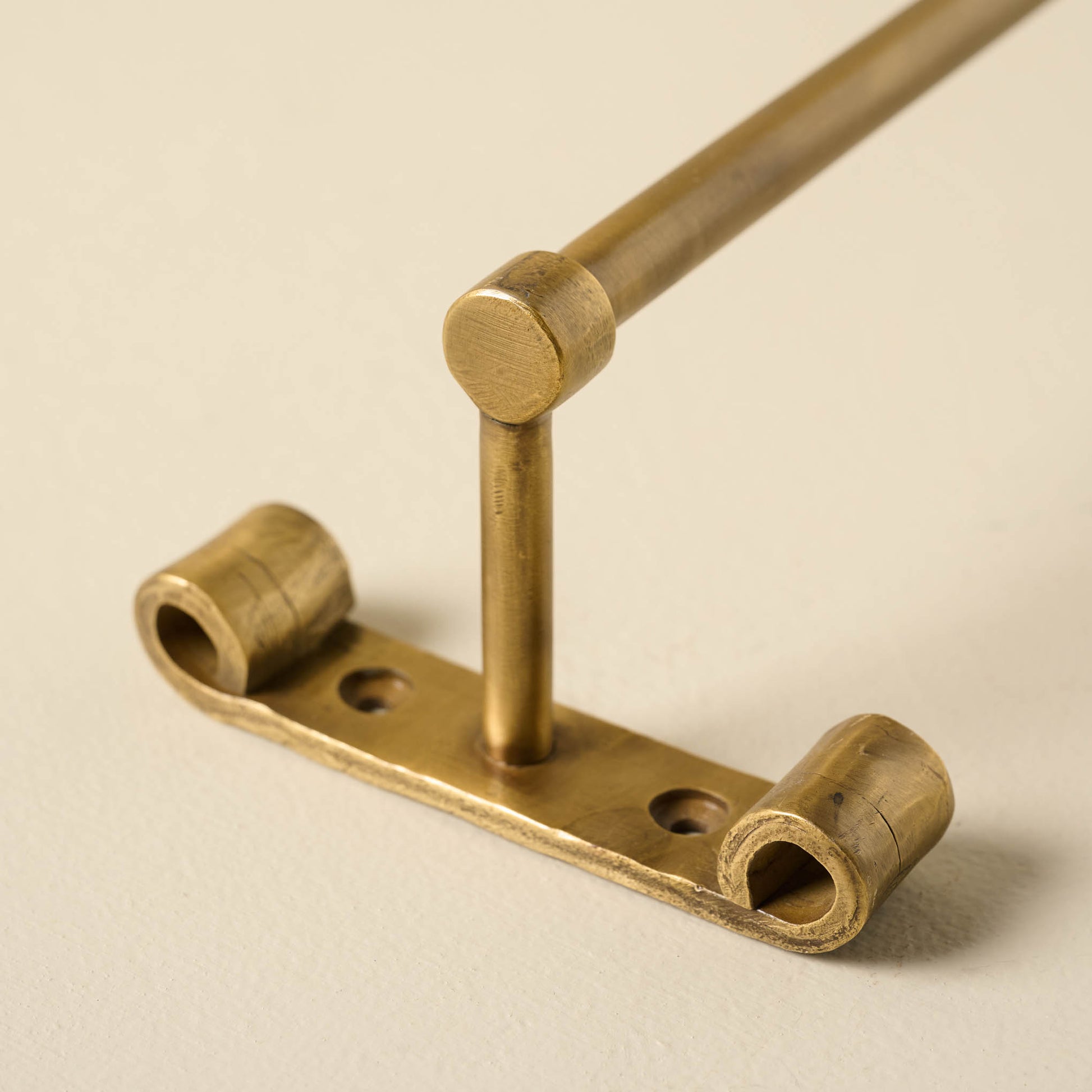 Duke Brass Rail with Hooks close up of hanging hardware