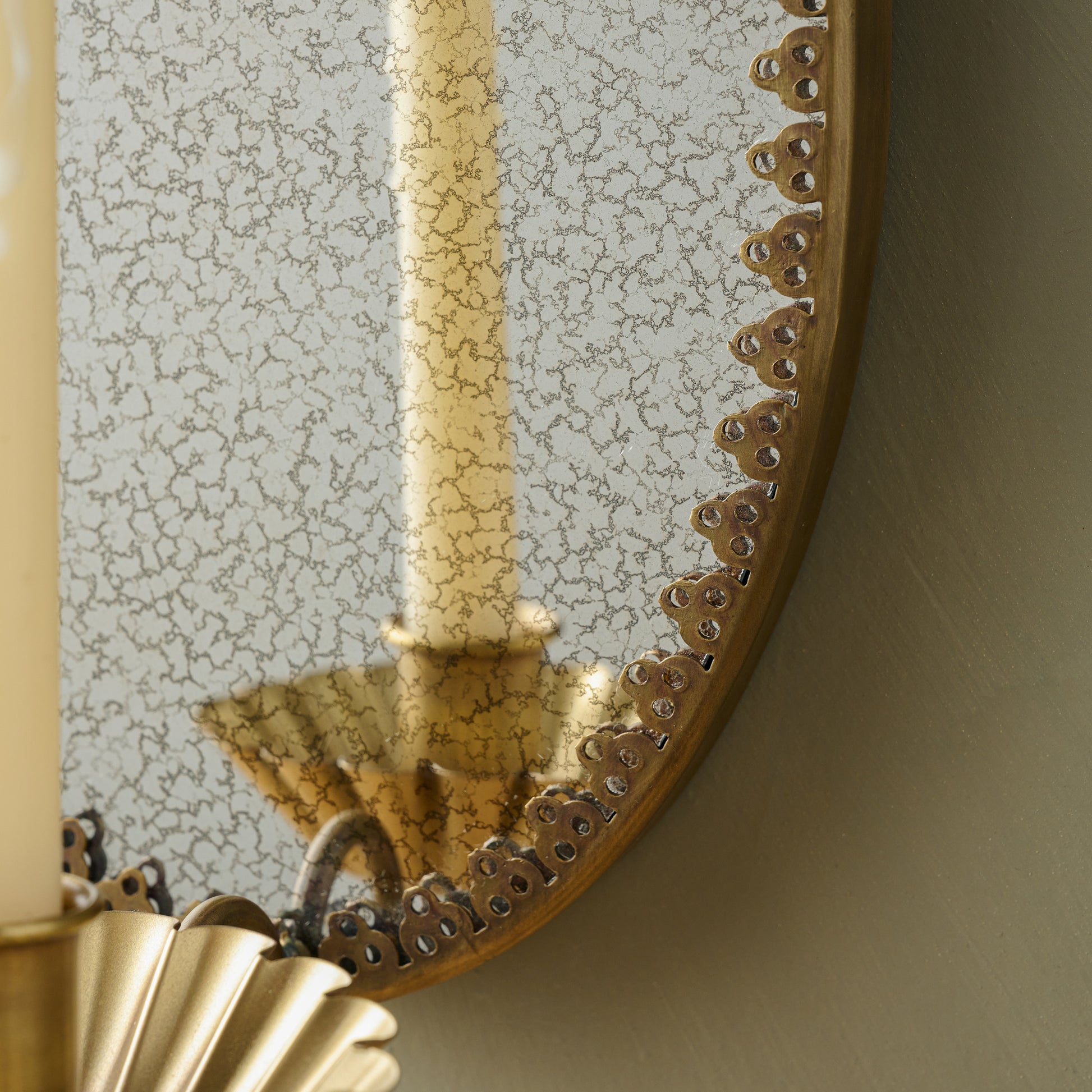 Oval Antique Mirrored Sconce close up of mirror 