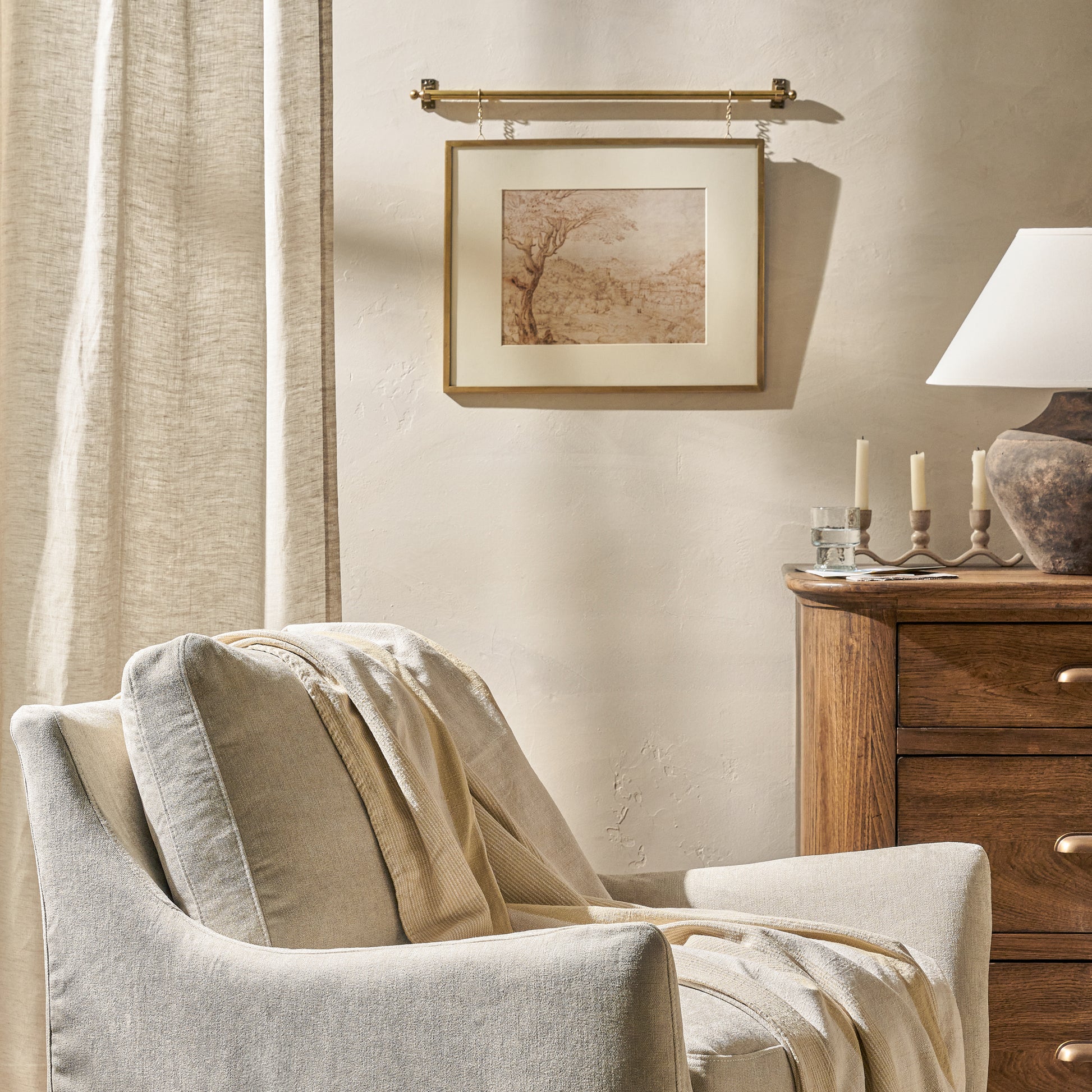 Colleen Brass Rail Picture Frame on a wall in a room