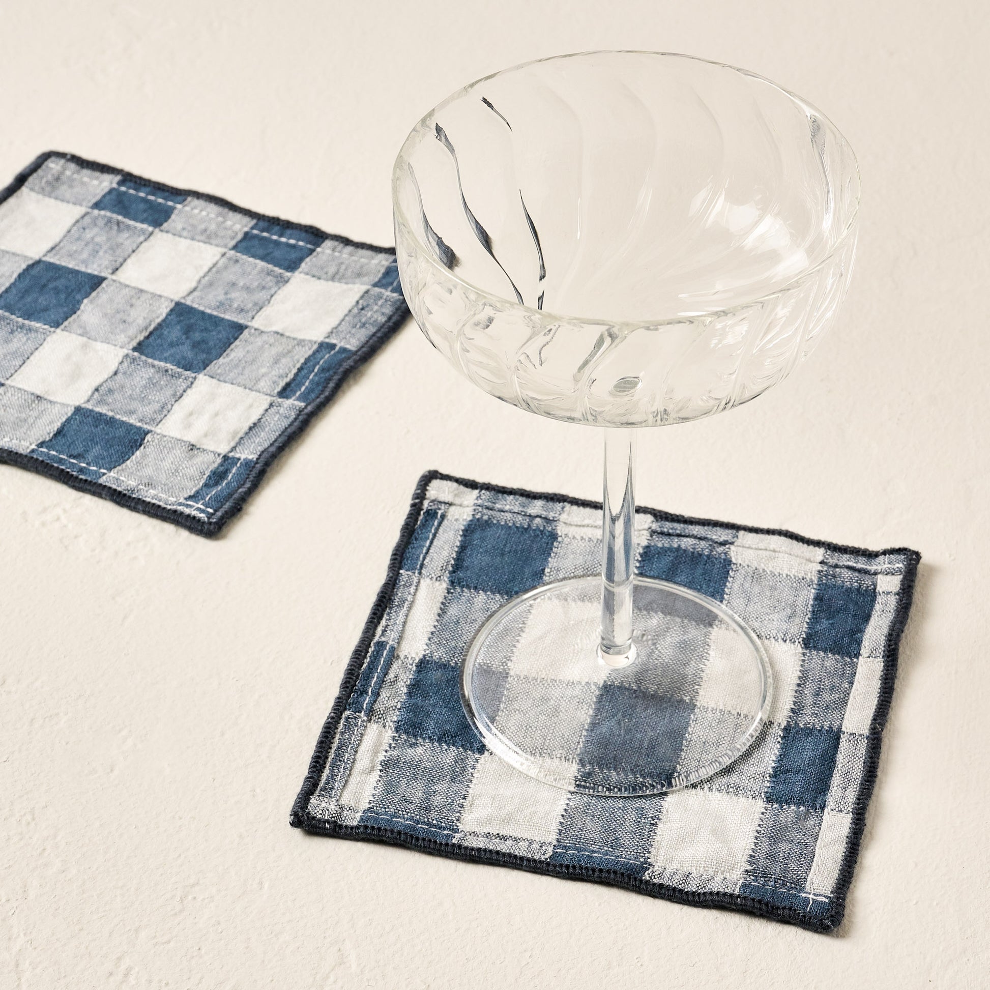 Fluted Coupe Glass with blue checkered napkin