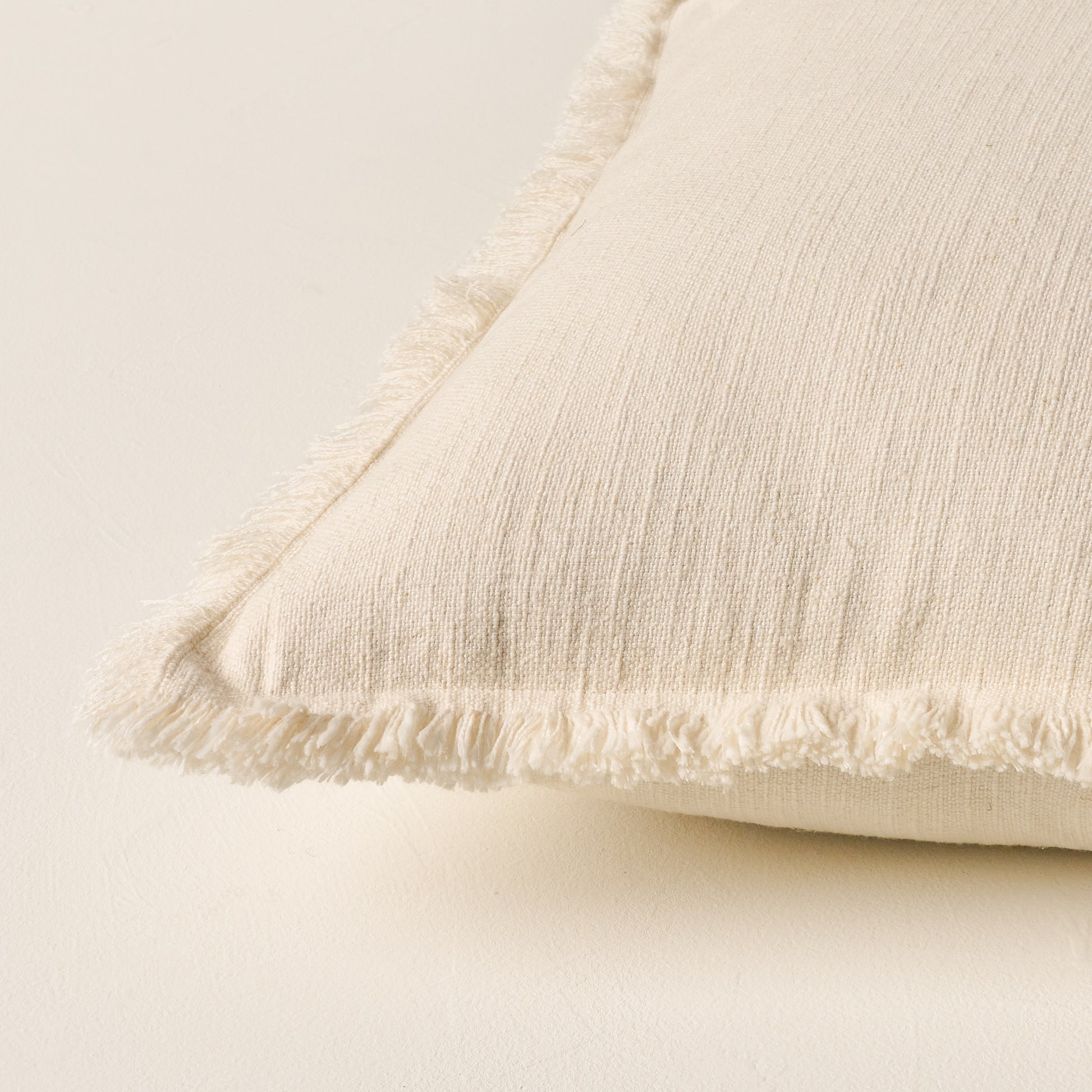Sydney Heathered Pillow in whitecap grey shown up close on the corner