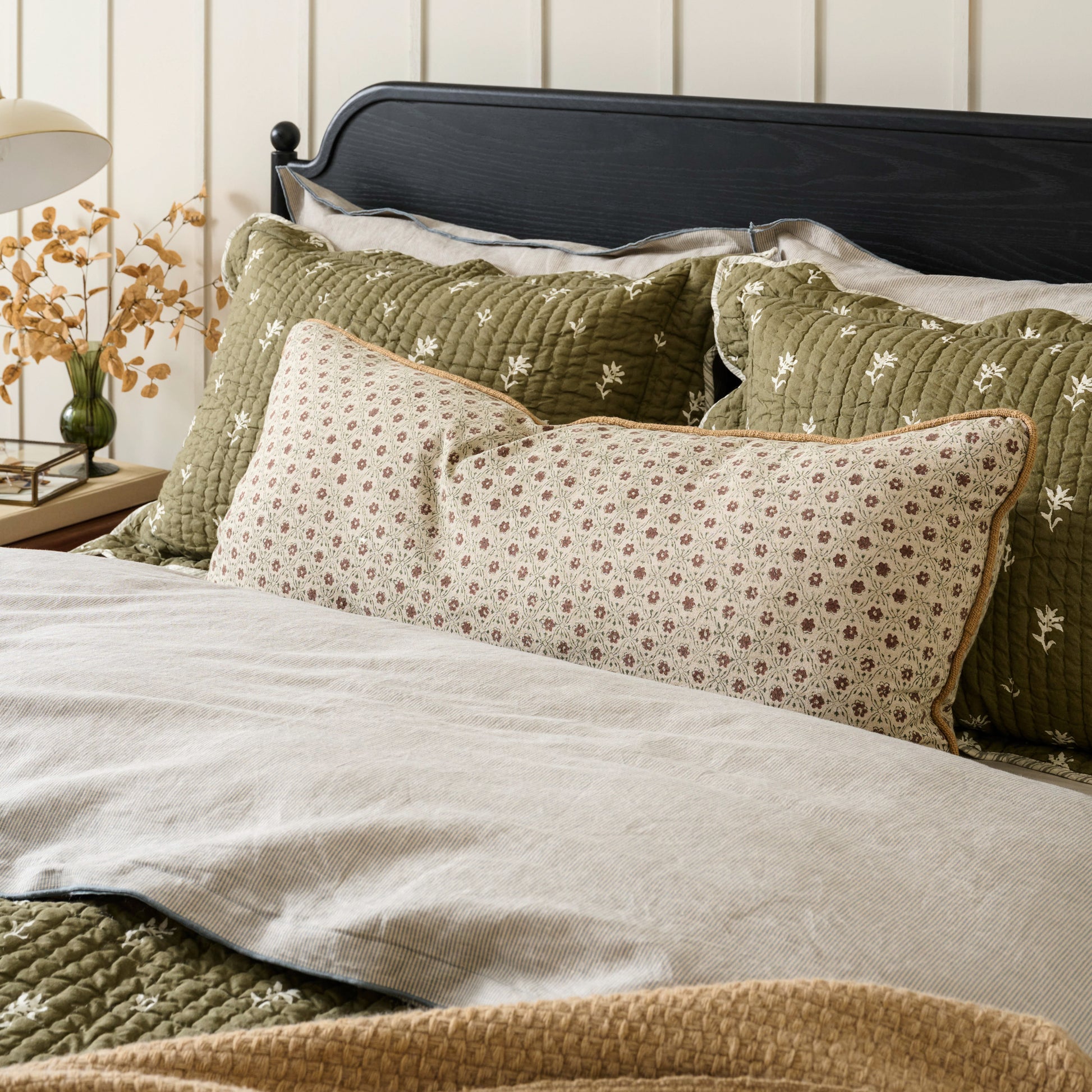 Thea Clay Block Print Large Lumbar Pillow shown on bed