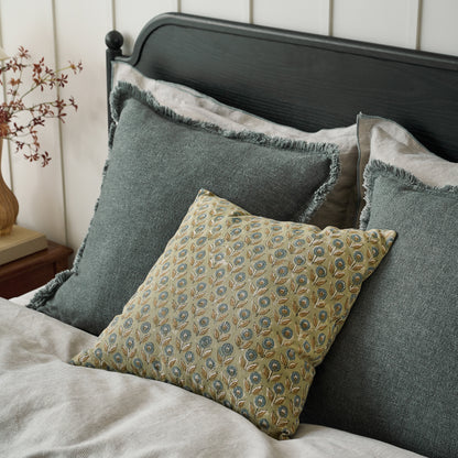 Sydney Heathered Pillow in Sedona Sage shown on bed