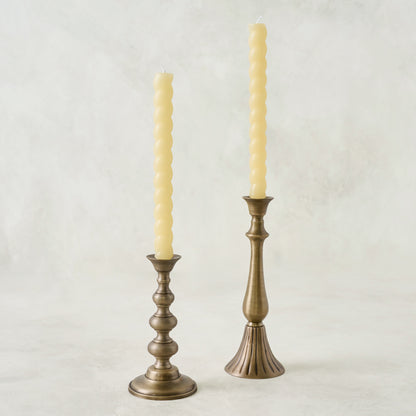 Faris Antiqued Brass Candleholders shown with twisted tapers