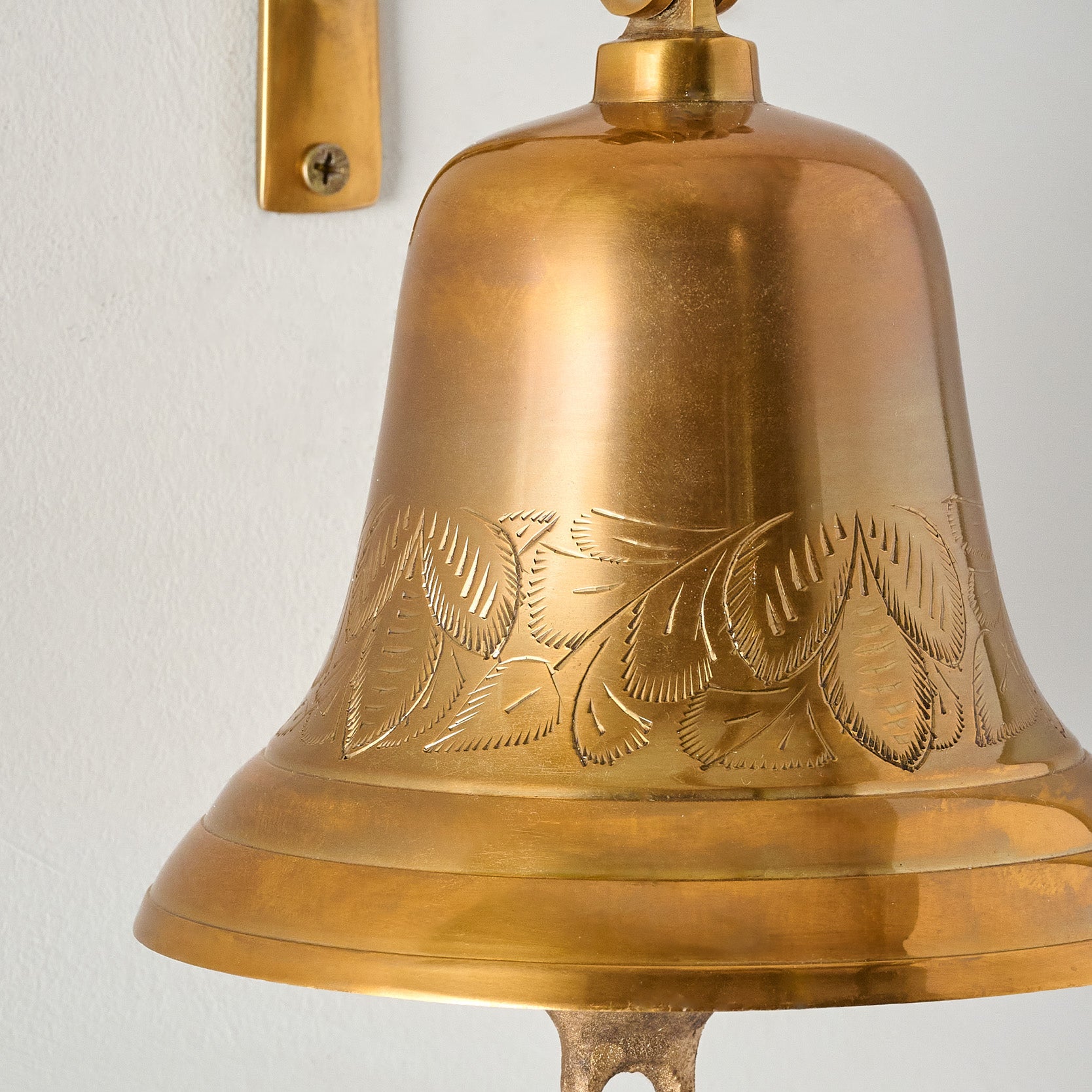 Polished Brass Etched Wall Bell close up