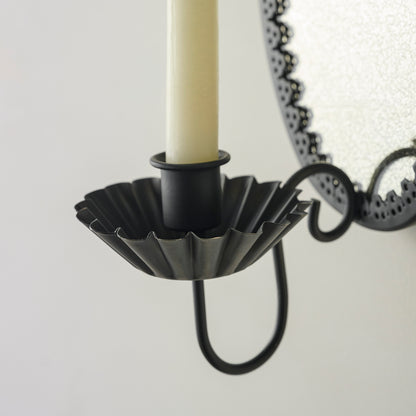 black Oval Antique Mirrored Sconce up close