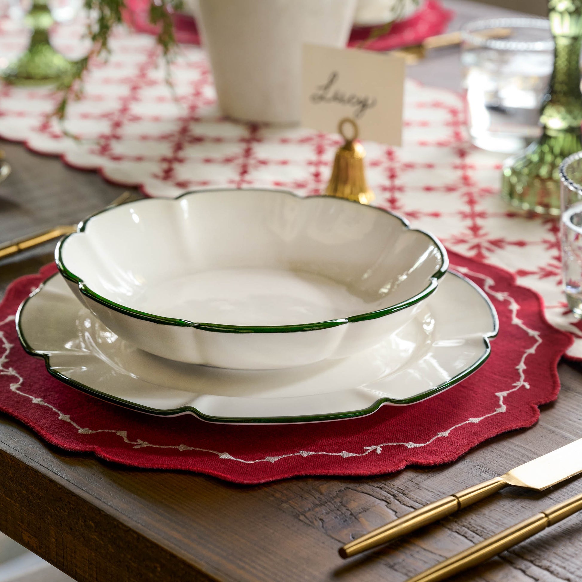 Green Luna Scalloped Pasta Bowl at a table