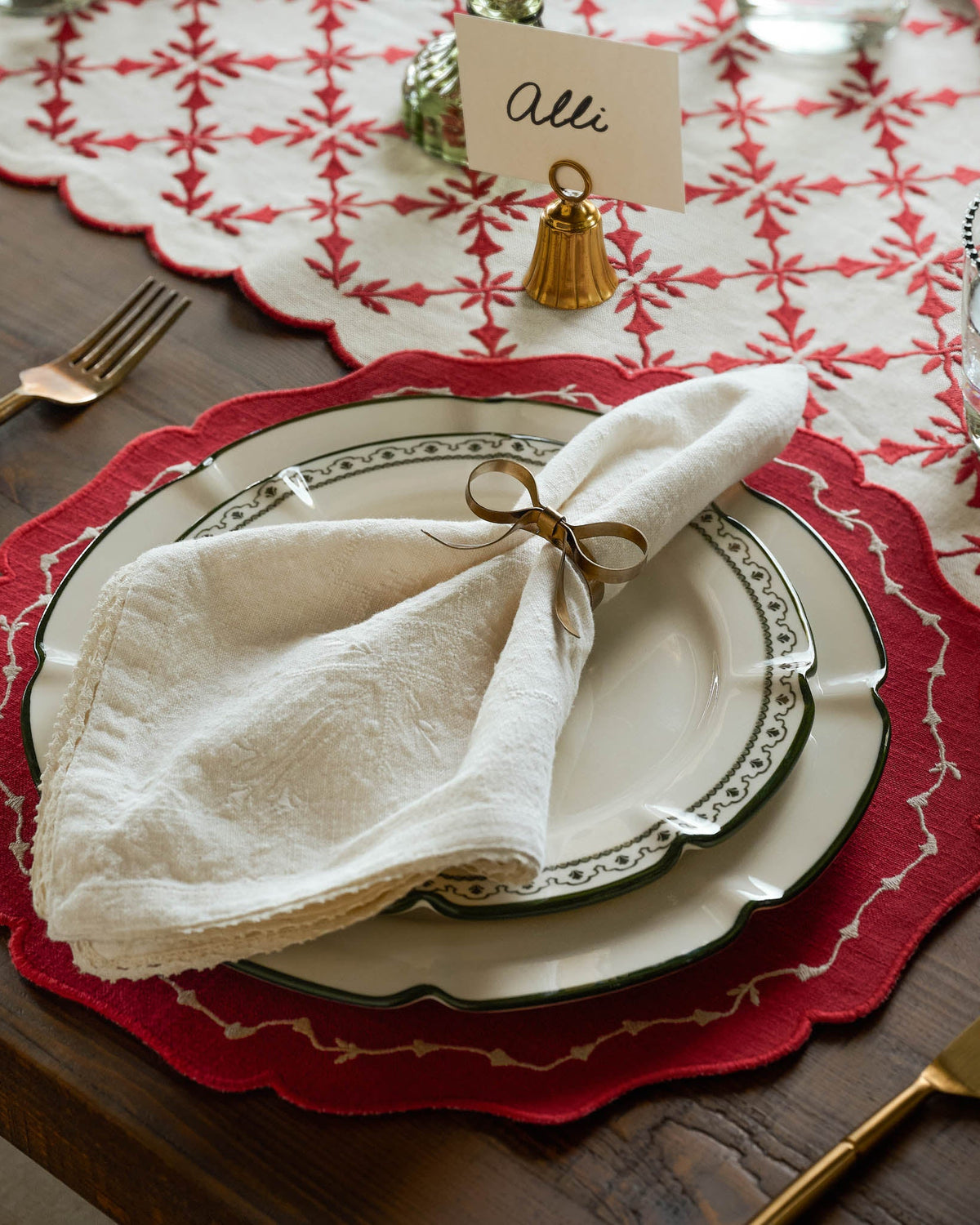 Brass Bell Place Card Holder on a table