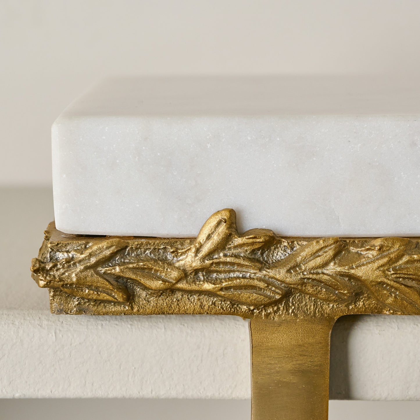 Marble and Gilded Stocking Holder shown up close