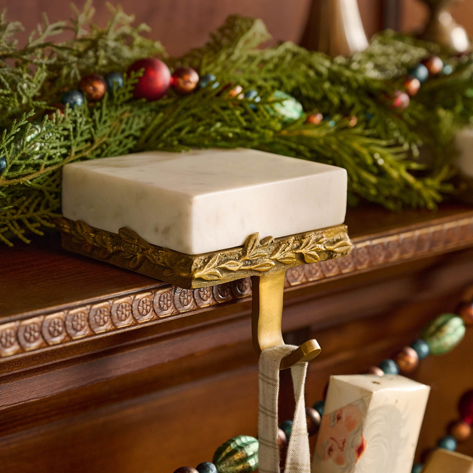 Marble and Gilded Stocking Holder in a room