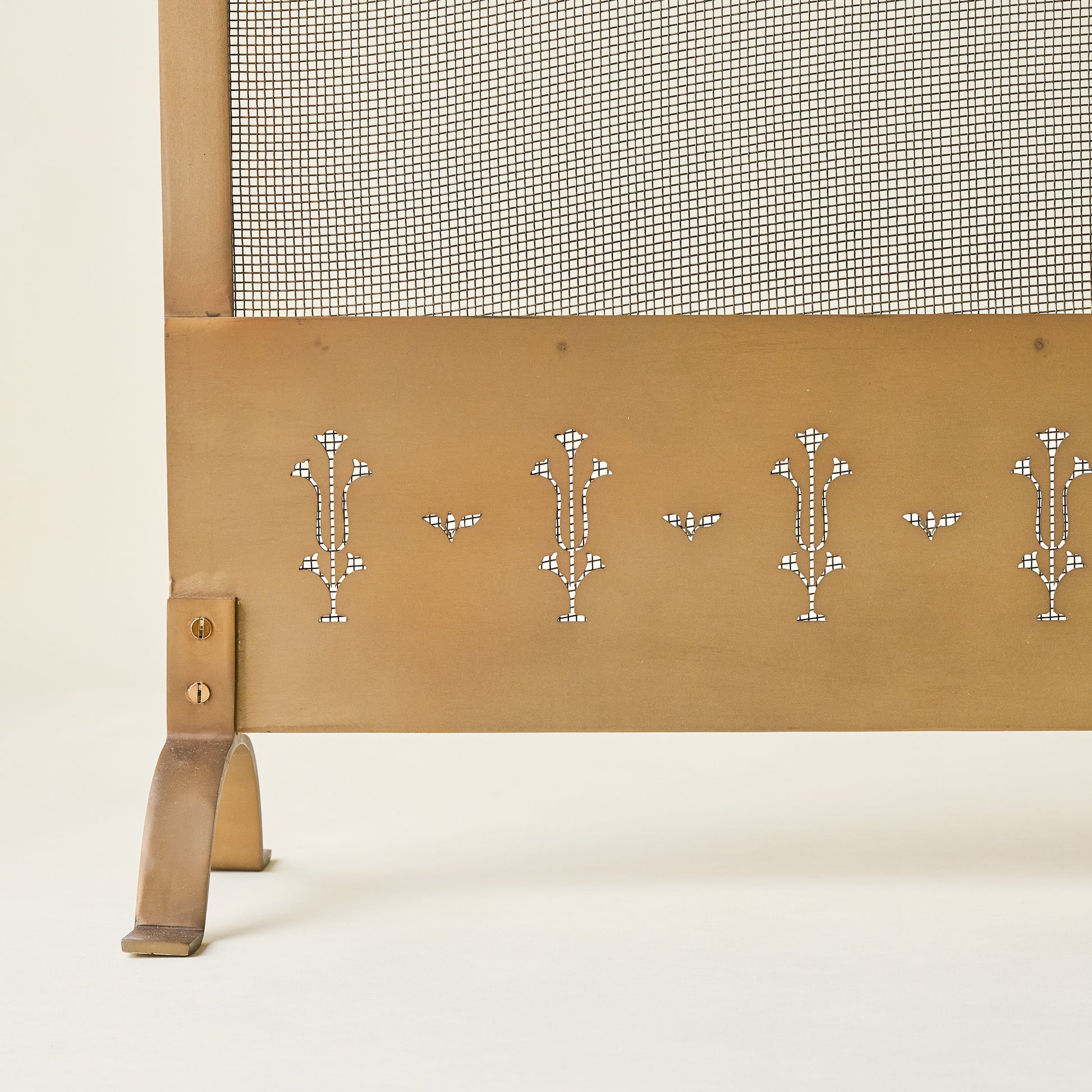 Antiqued Brass Tulip Carved Fireplace Screen up close