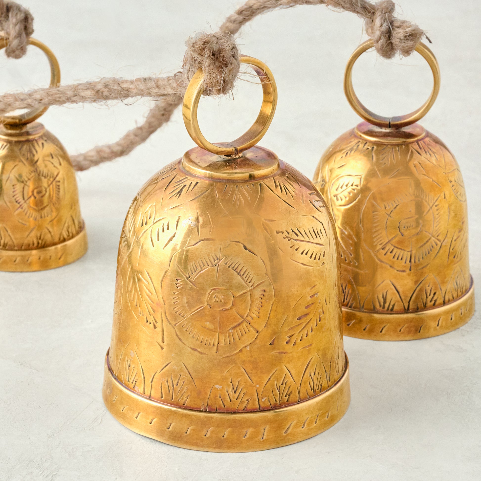 Etched Brass Hanging Bells up close