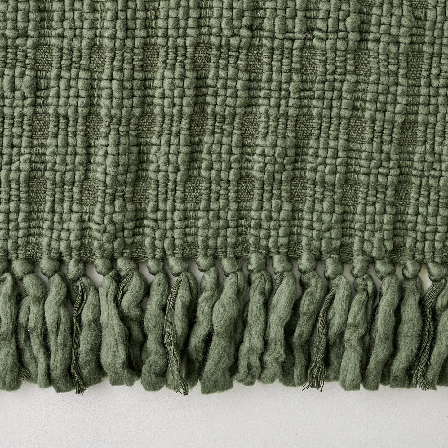 Haven Knit Throw in Forest Green up close