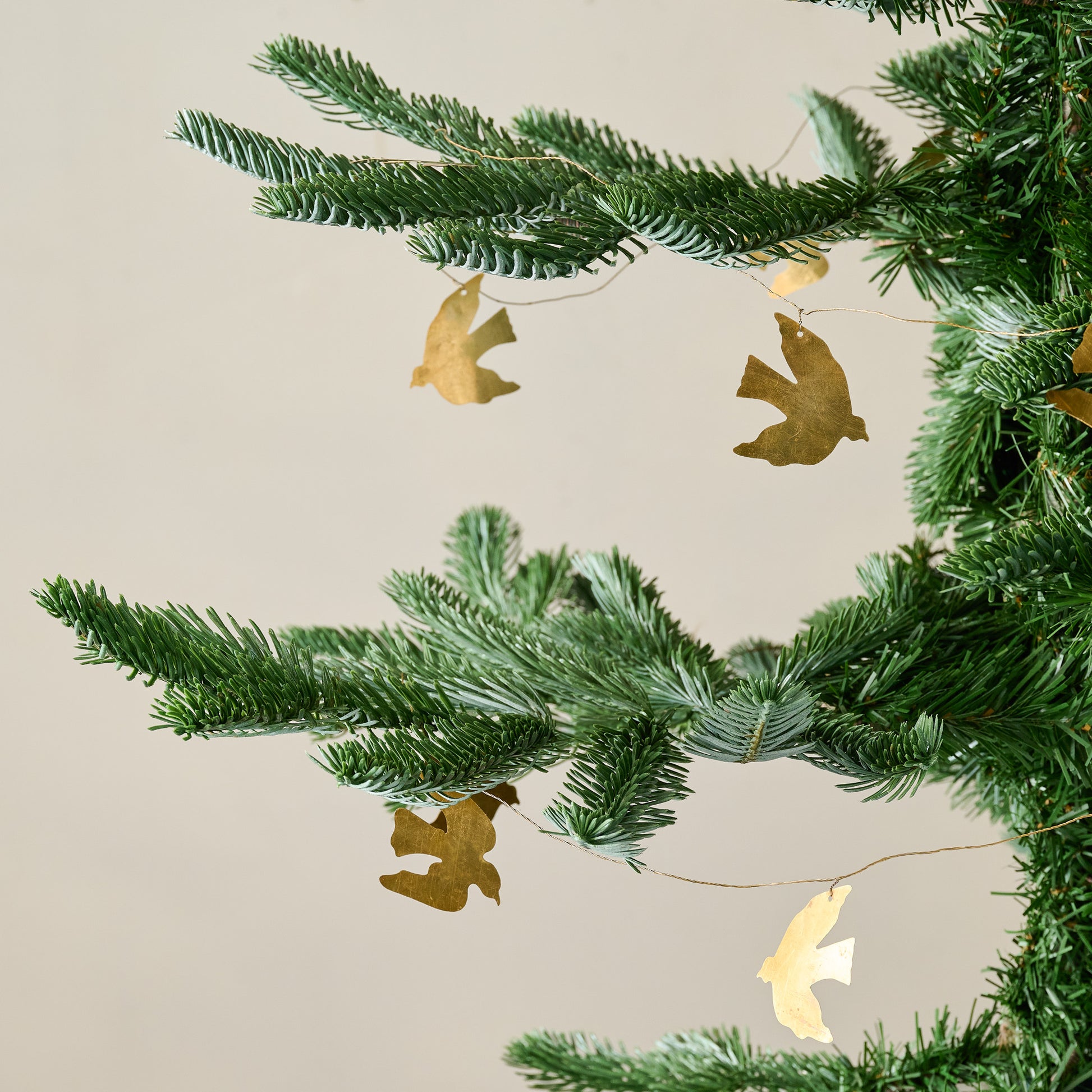 Brass Dove Garland shown on tree