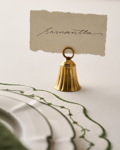 Brass Bell Place Card Holder shown holding card