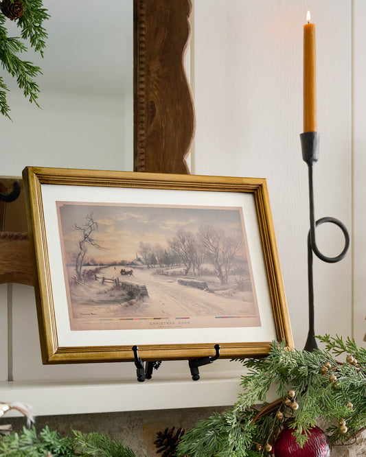 Vintage Christmas Morn Framed Print on a mantel