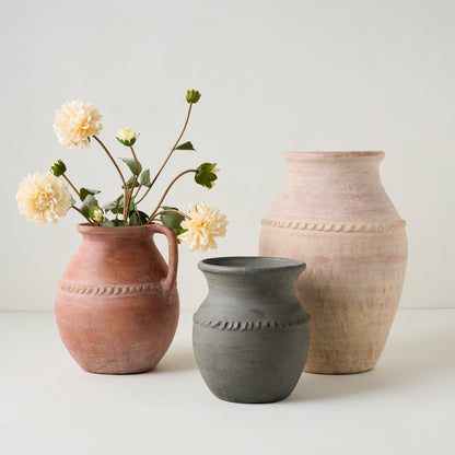 Camila Rust Terracotta Vase with Handle shown with other vases