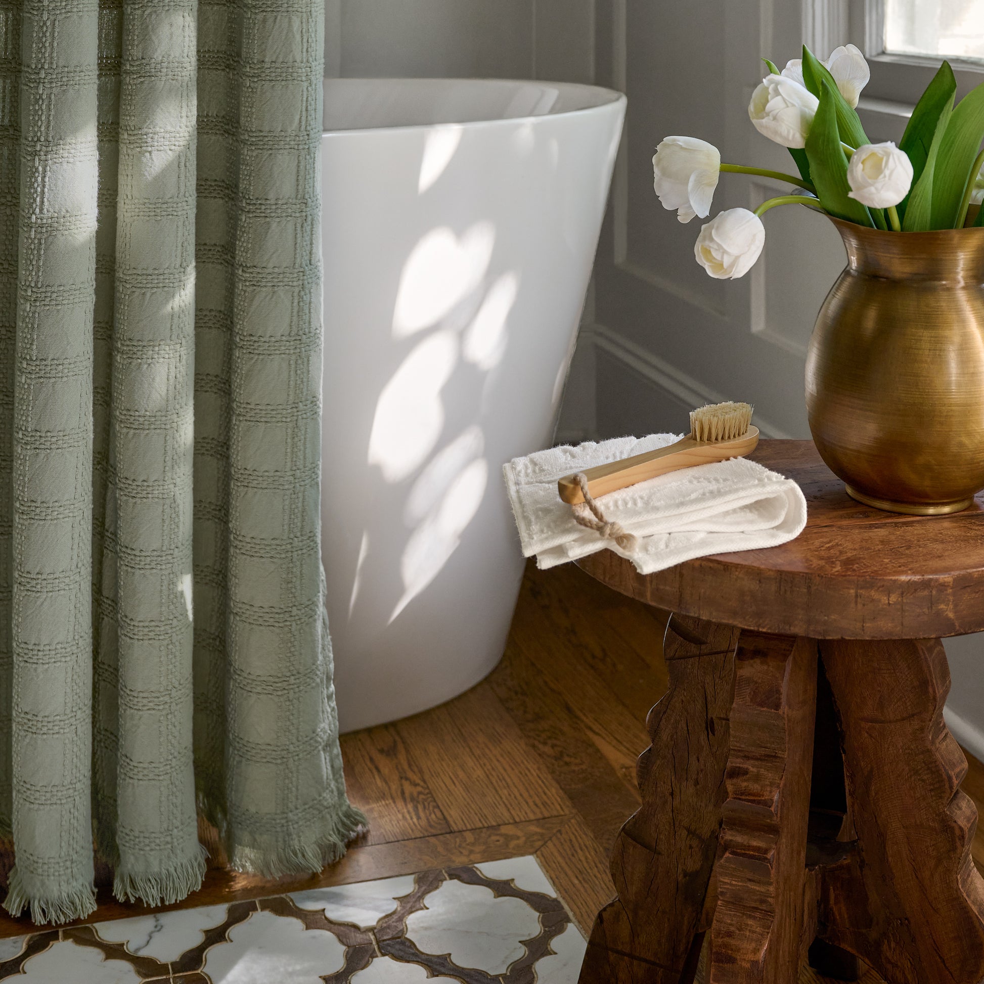 Sage Textured Shower Curtain hanging up