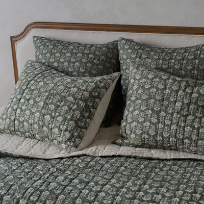 Flora Block Print Pillow Sham - Dusty Green shown on bed