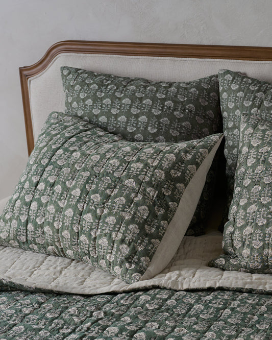 Flora Block Print Pillow Sham - Dusty Green shown on bed
