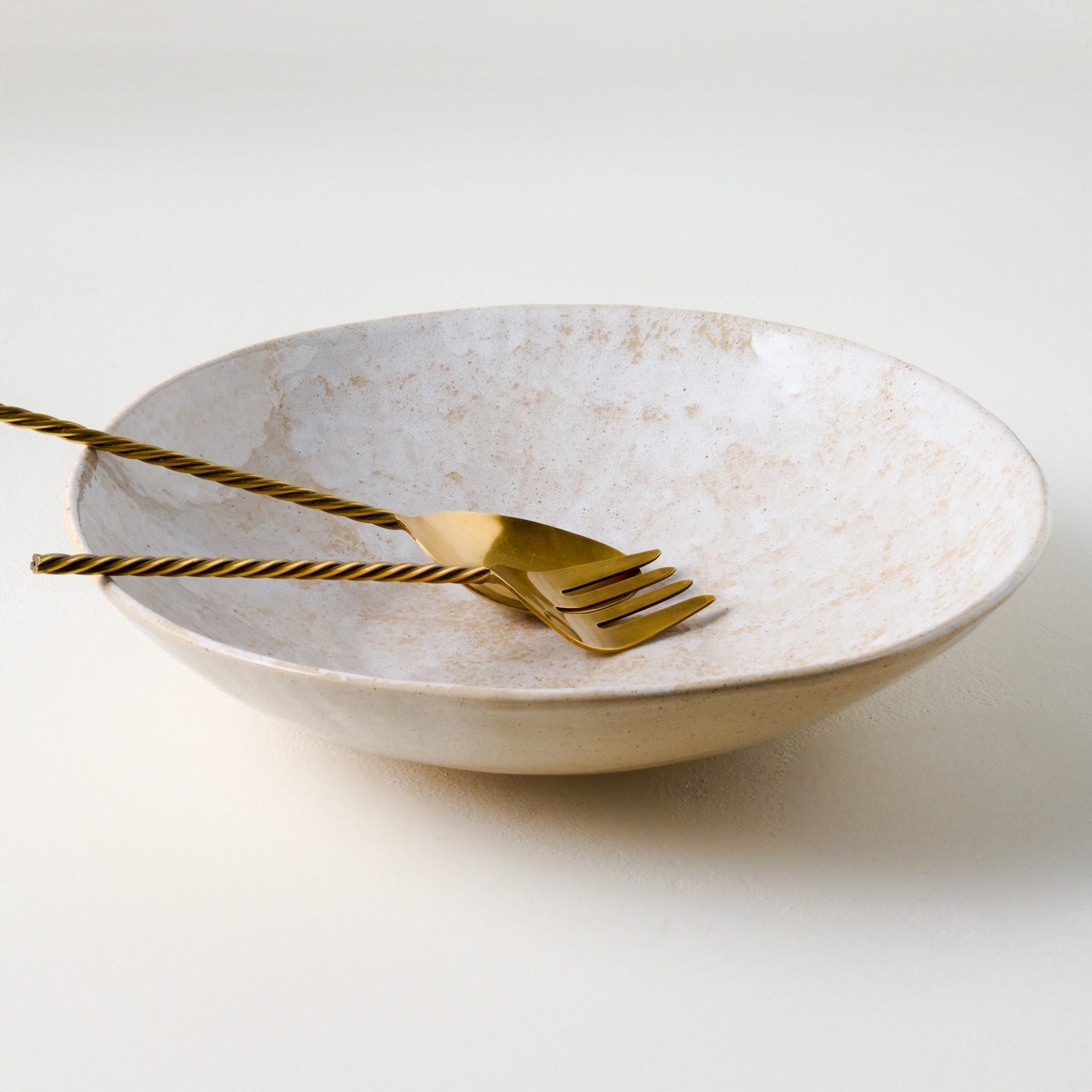 Oversized Ceramic Spongeware Serving Bowl shown with serving utensils