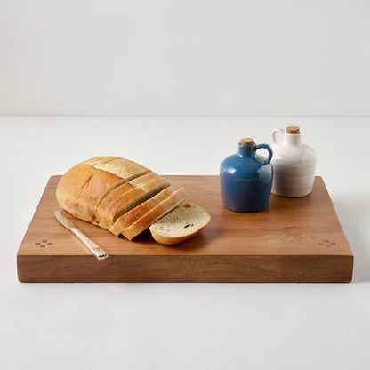 Ceramic Oil Dispensers shown on board with bread