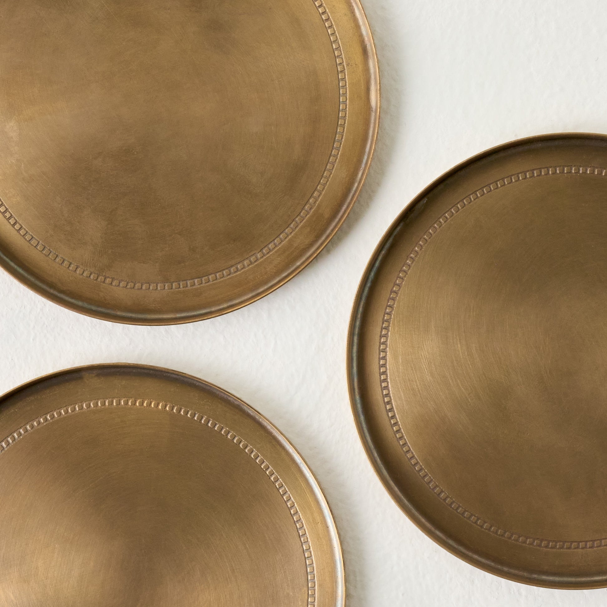 Magnolia Etched Brass Coaster Set of Four up close