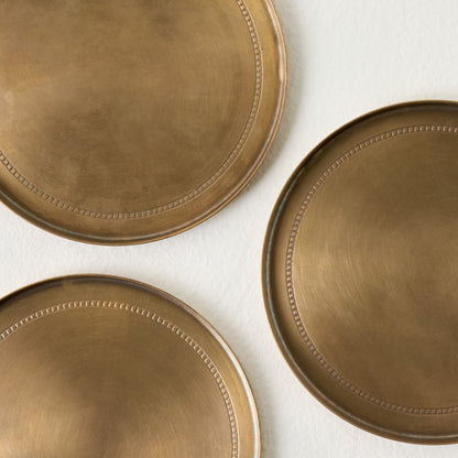 Magnolia Etched Brass Coaster Set of Four up close