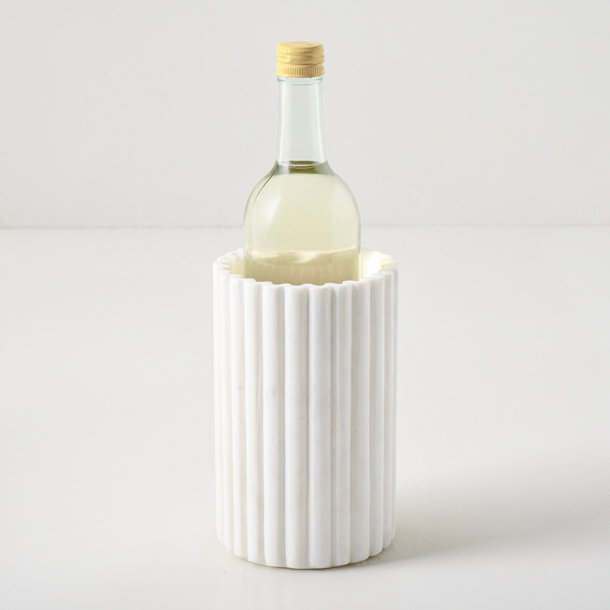 Fluted Marble Crock shown with bottle