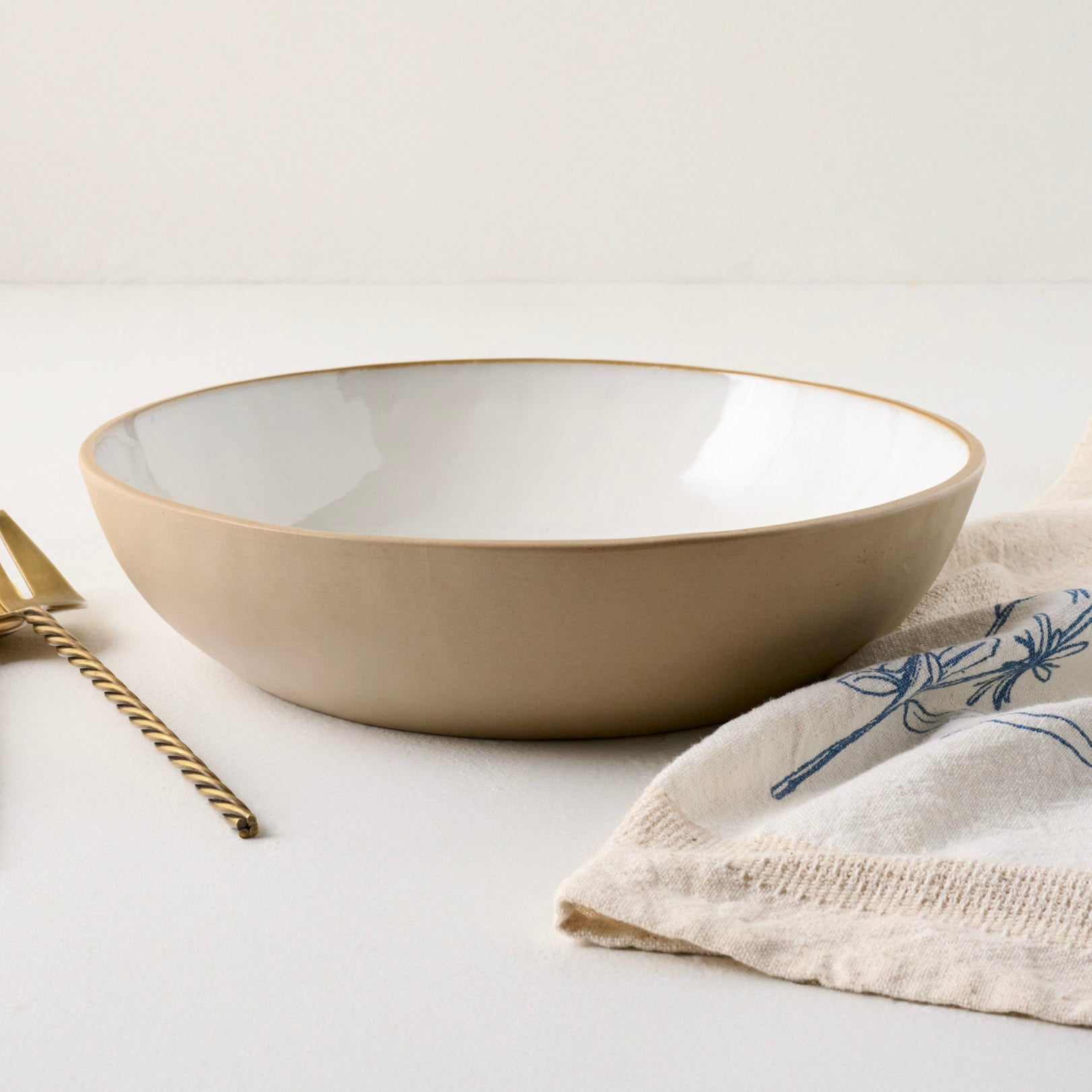 Stone White Lakelynn Serving Bowl shown with accessories