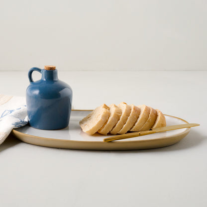 Blue Heaven Ceramic Oil Dispenser shown with bread