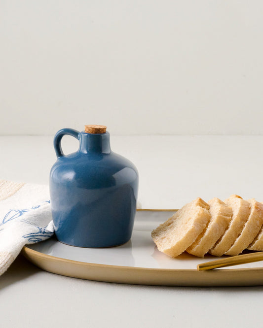 Blue Heaven Ceramic Oil Dispenser shown with bread