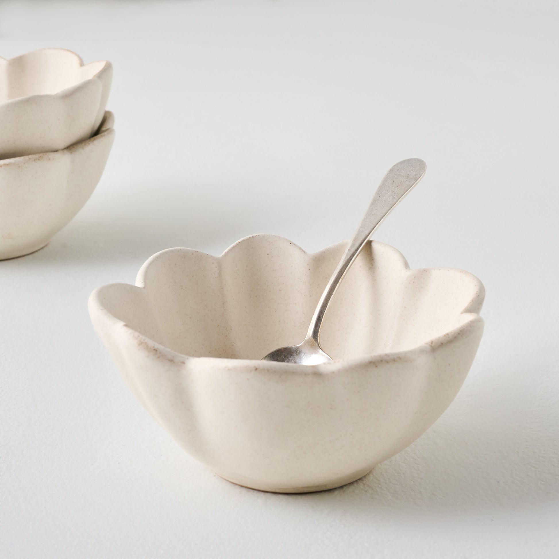 French White Scalloped Mini Bowl shown with spoon