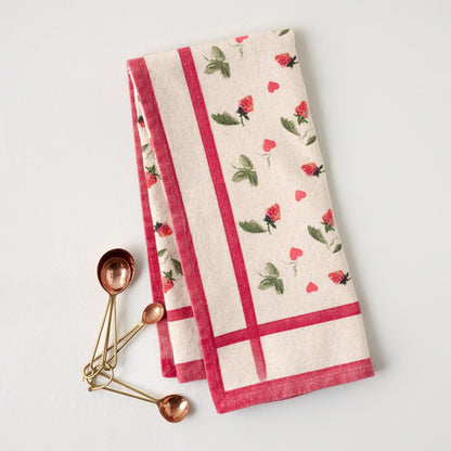Magnolia Strawberry + Hearts Tea Towel  shown with measuring spoons
