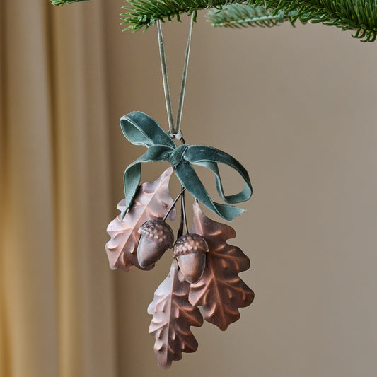 Pressed Metal Oak Leaf Ornament shown hung from tree