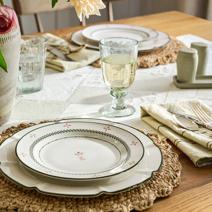 Green Luna Scalloped Plate on a table