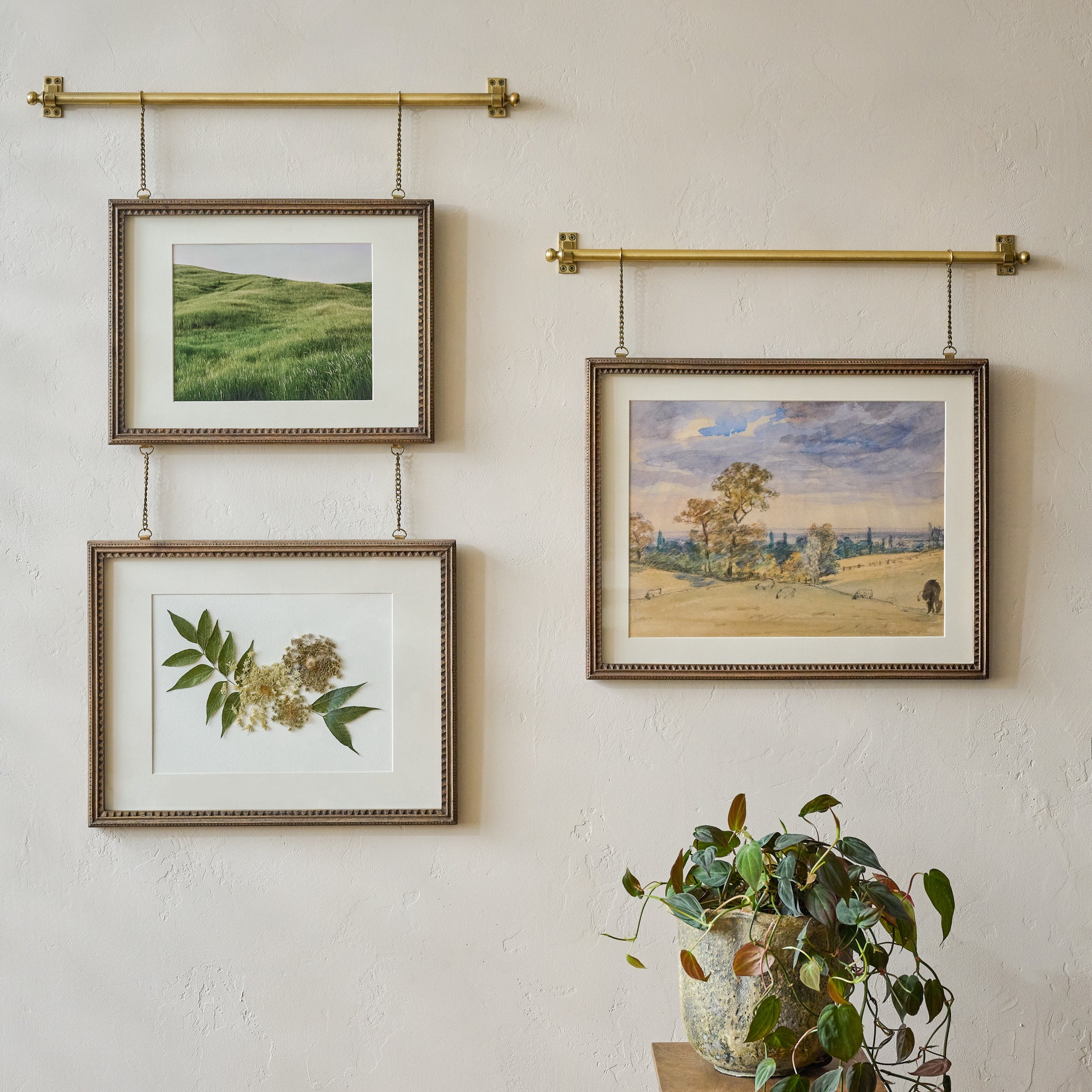 Colleen Wood and Brass Rail Picture Frame shown styles on wall