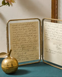 Antiqued Brass Double Photo Frame shown with note inside