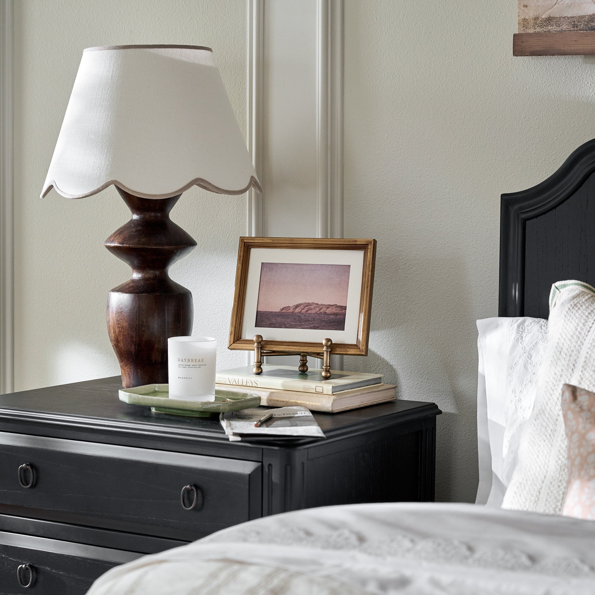 Arthur Antiqued Brass Photo Easel shown styled on nightstand