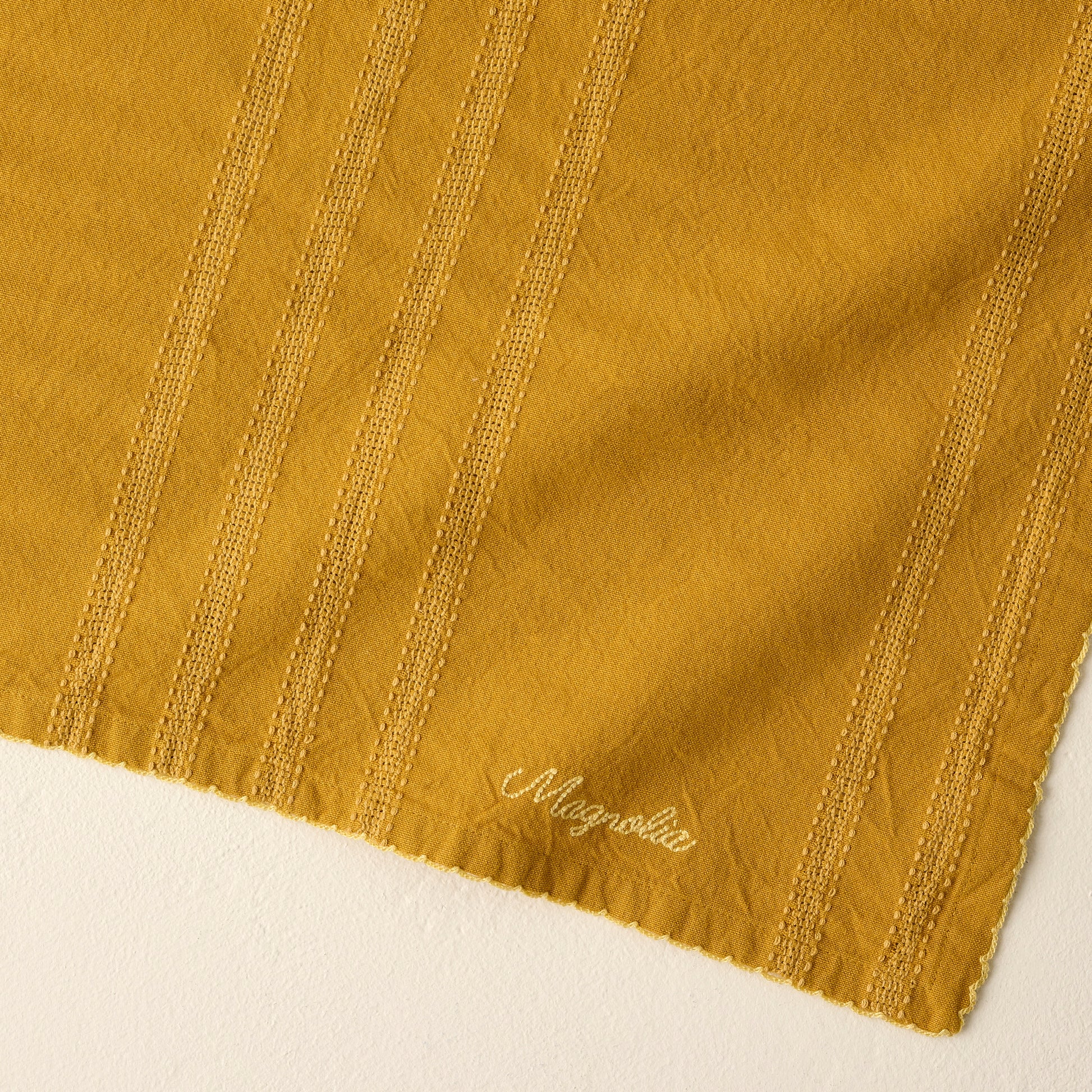 Magnolia Harvest Gold Striped Tea Towel up close
