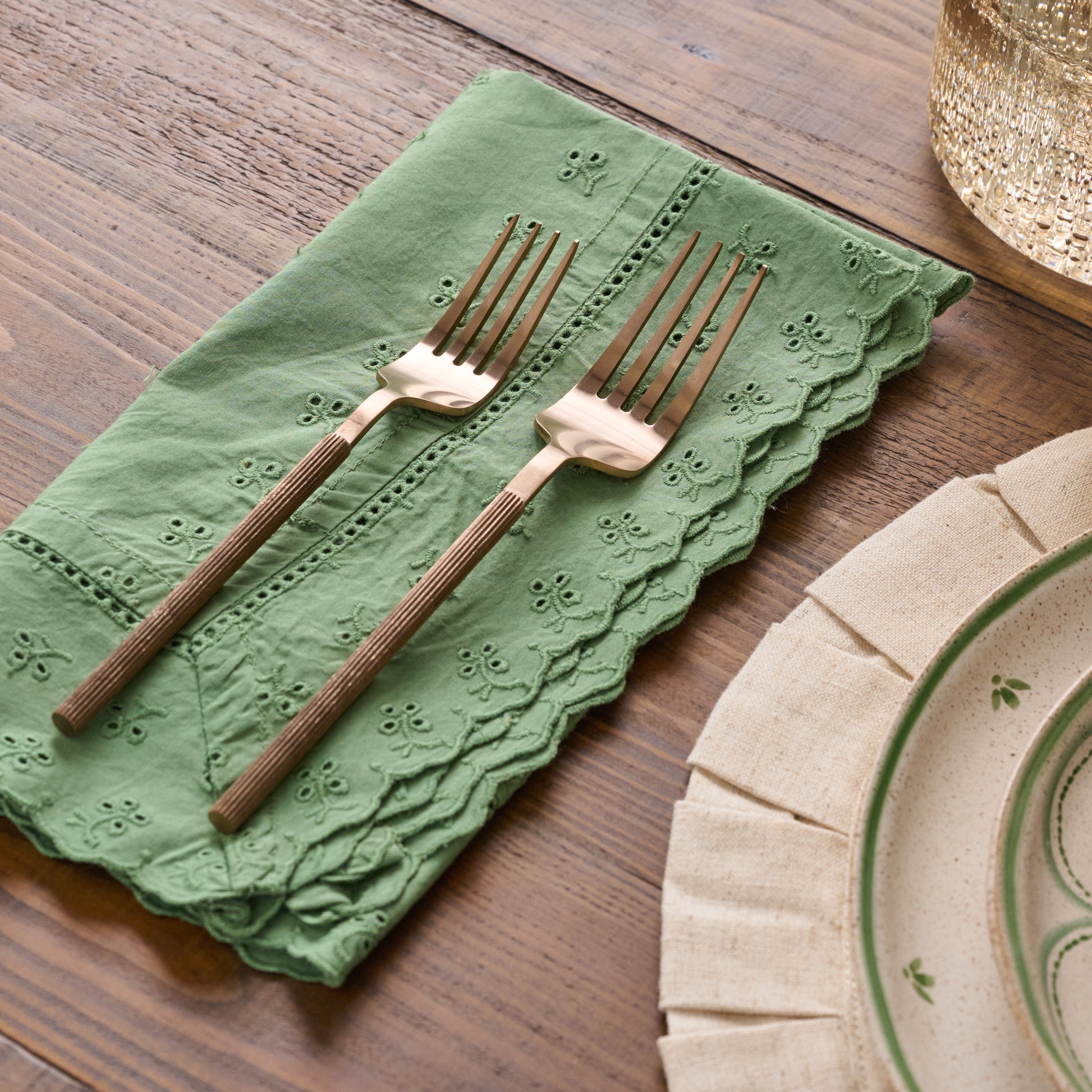 Antique Copper Ribbed Flatware Set of Five shown with napkin and place setting